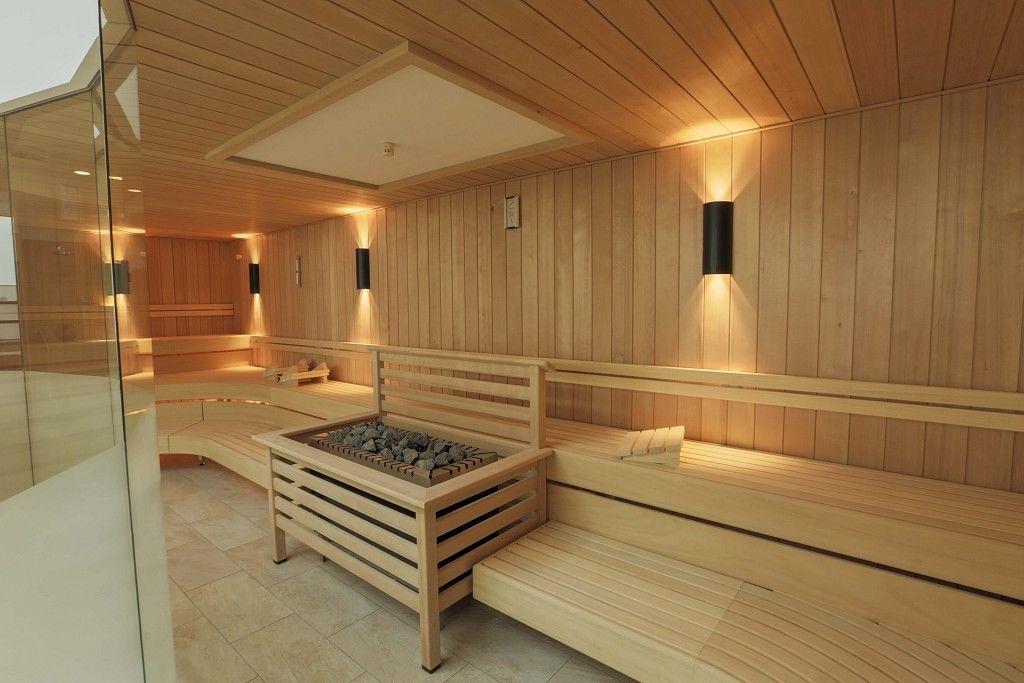 Water hitting hot sauna stones and creating steam